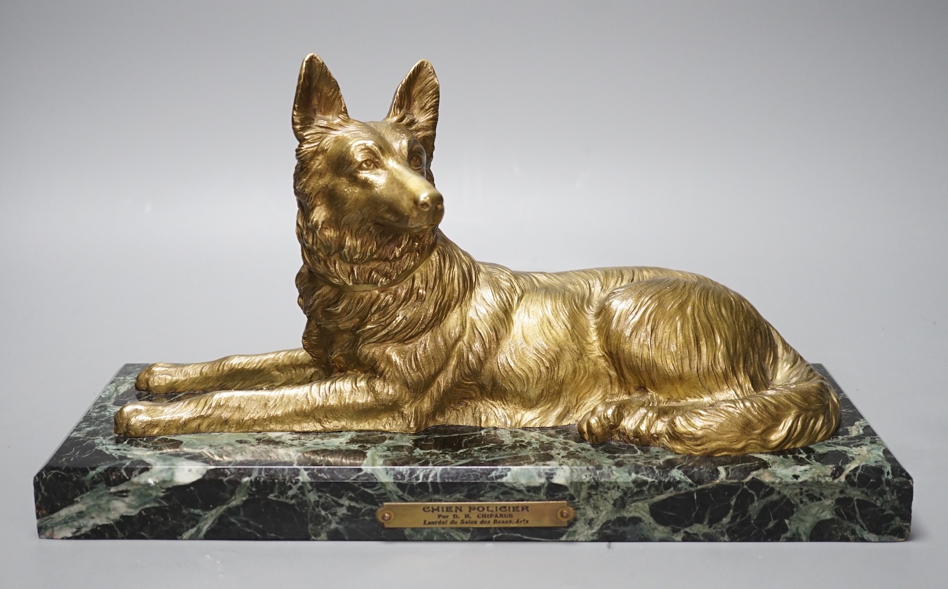 After D H Chiparus, a gilt metal figure of a German Shepherd dog, on marble base, 36 cms wide